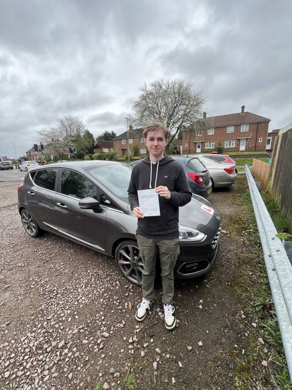 Pupil with pass certificate beside the Keane2Learn tuition car